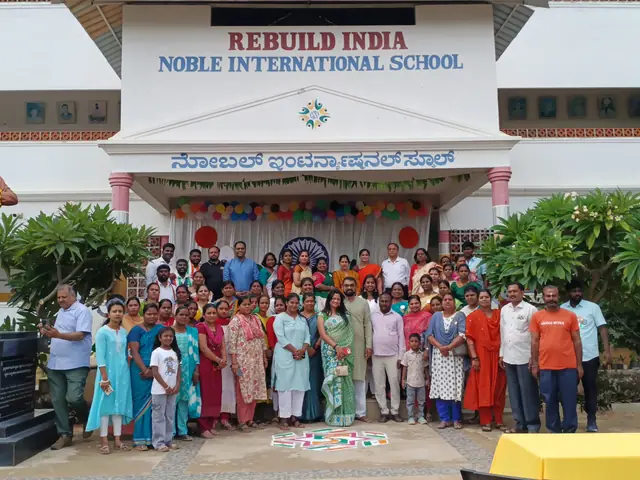 The assembled crowd across the forecourt in front of the two-storey school block