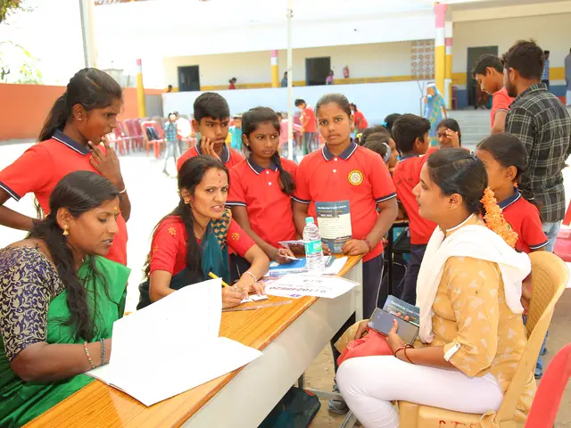 Schoolgirls cluster around an outdoor registration table handing over forms