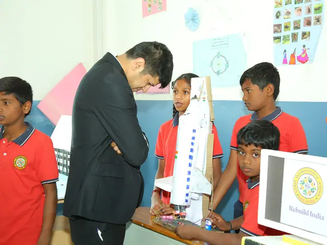 Boys queue in a decorated classroom while a man measures one boy's height against a chart